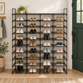 10-tier black shoe rack filled with shoes in a bright entryway